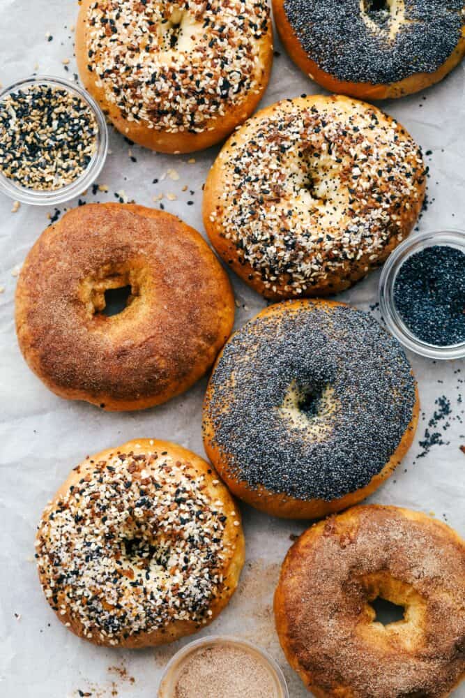 Bagels with different types of toppings on them.