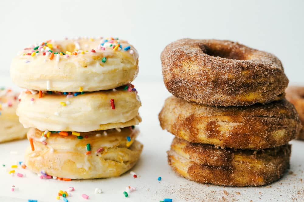 Stacked cinnamon and sugar and glazed donuts. 