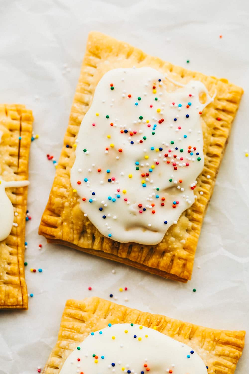 Strawberry homemade pop tart with frosting and sprinkles. 