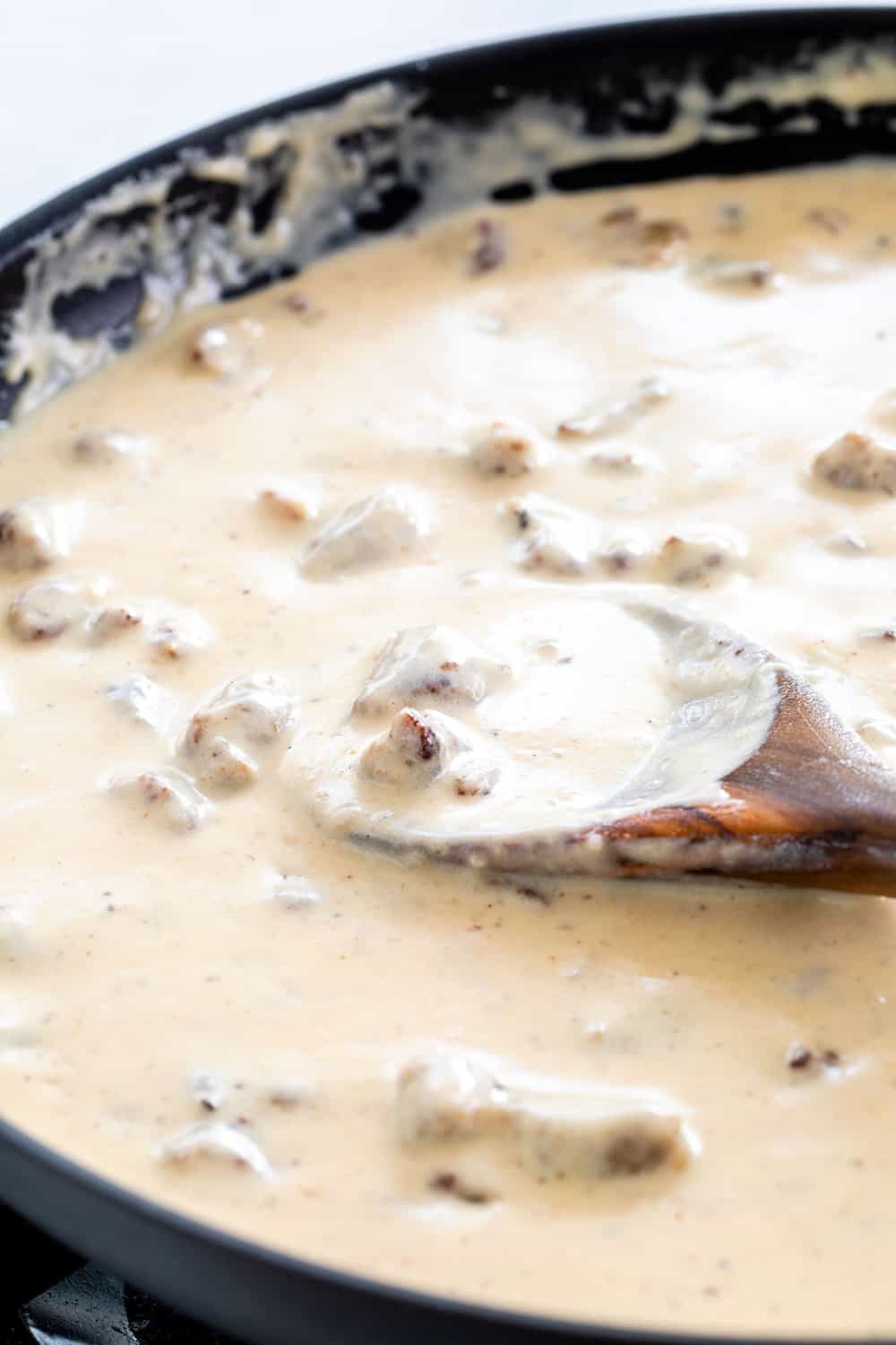 sausage gravy cooking in a pan
