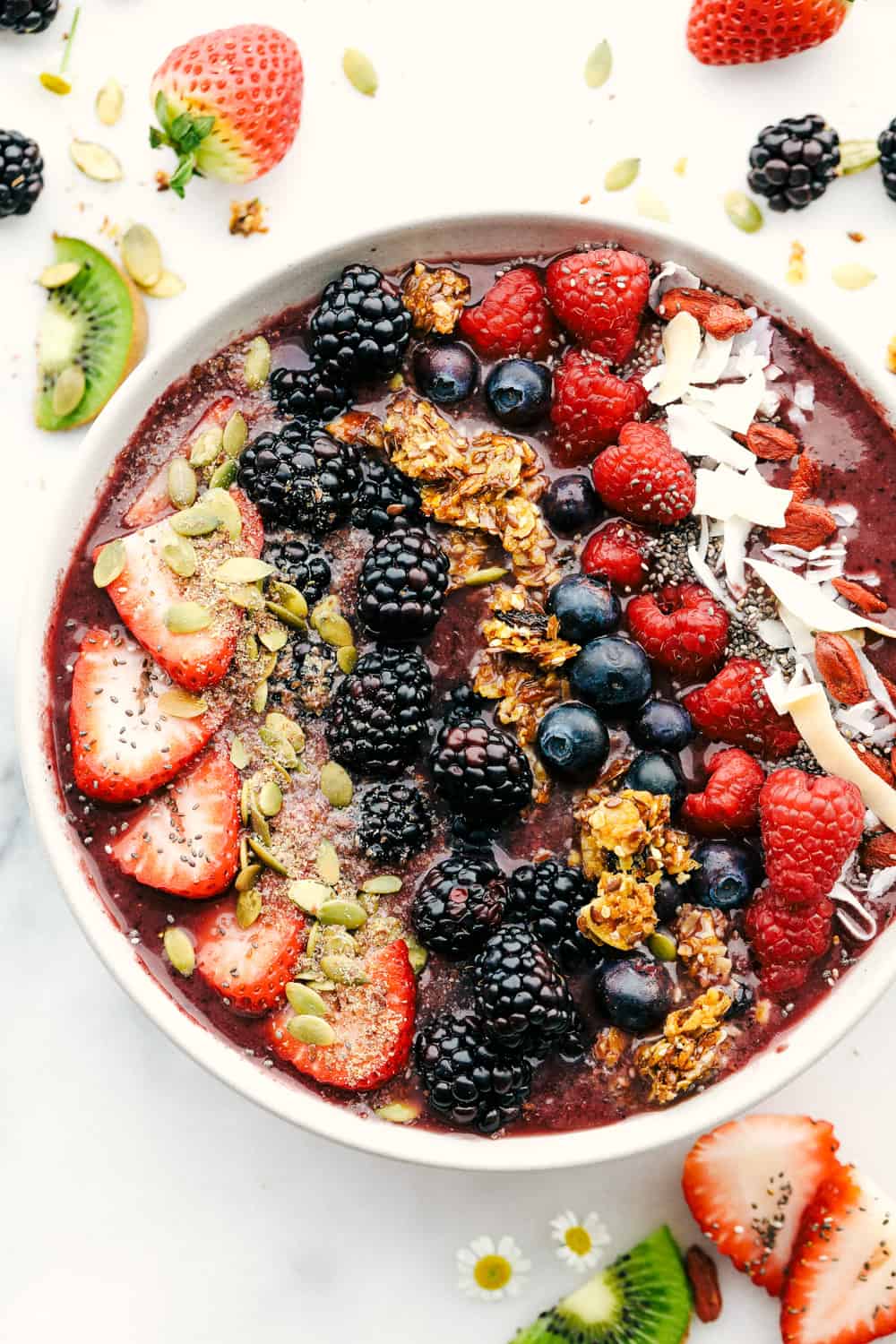 The very berry acai bowl with fruit and granola over top 