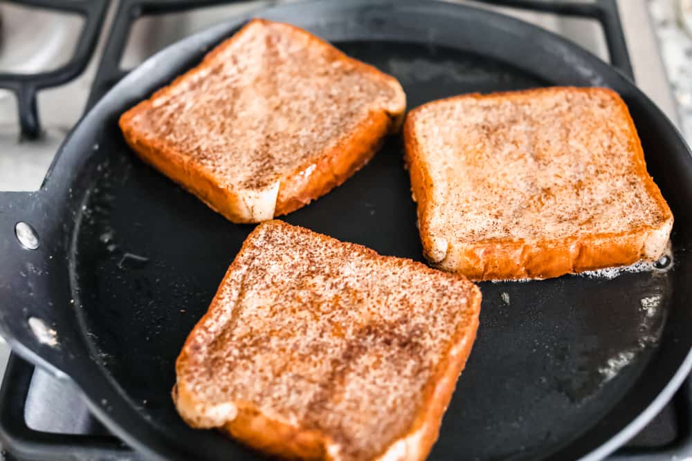 cooking French toast in a skillet on the stove top.