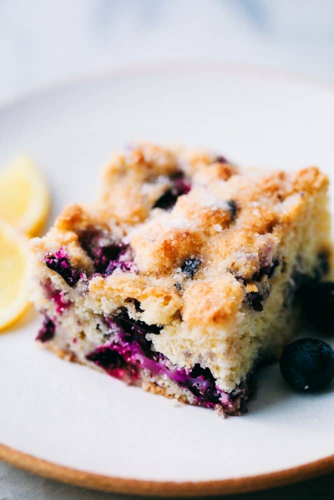 Close up on a slice of blueberry breakfast cake.
