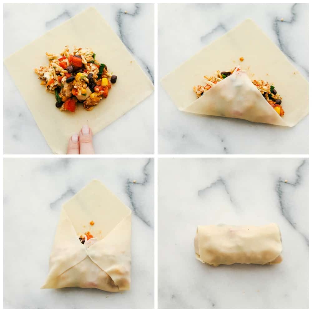 The process of wrapping the egg roll up with the egg roll mixture. 