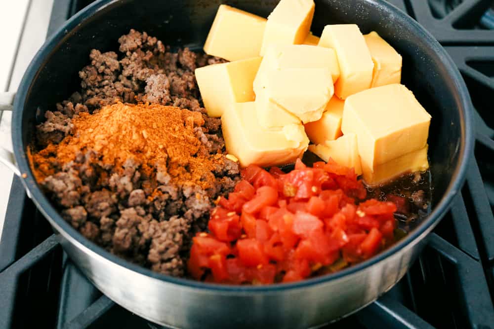 Mixing hamburger, cheese, spices and tomatoes for an amazing dip.