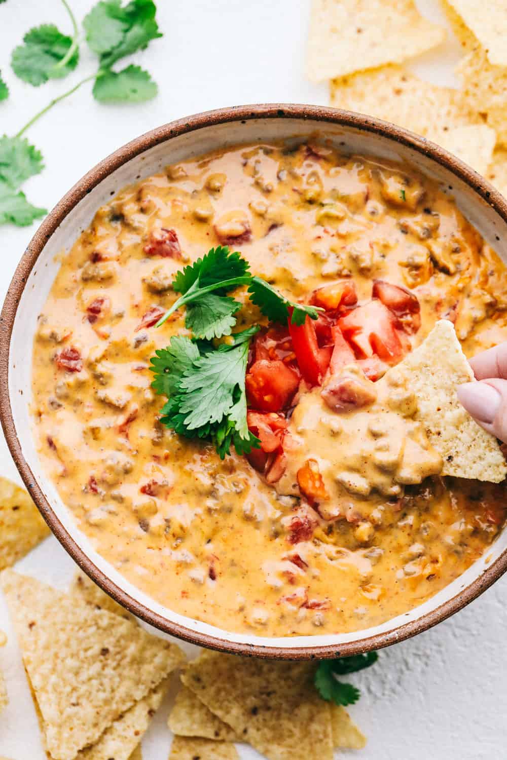 Creamy, spicy Rotel Dip with corn chips.