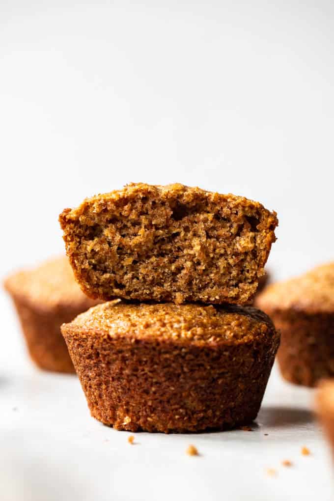 Bran muffins stacked on top of each other. 