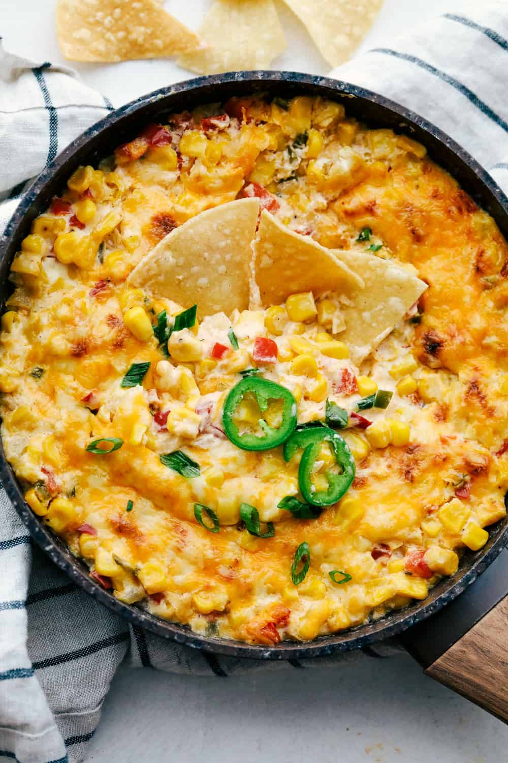 Hot Corn Dip with onions, peppers, jalapeno and ooey gooey cheese, served with corn chips.
