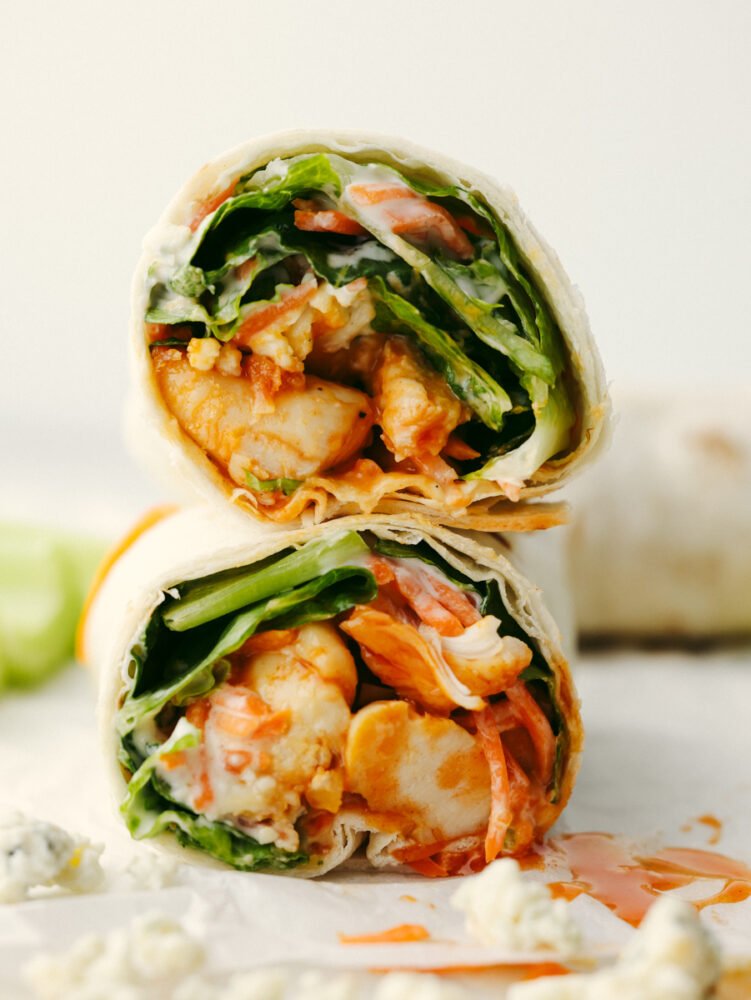 Two buffalo chicken wraps stacked on top of each other.