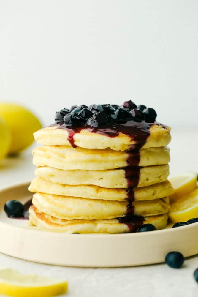 Stack of Lemon ricotta pancakes with blueberry sauce. 